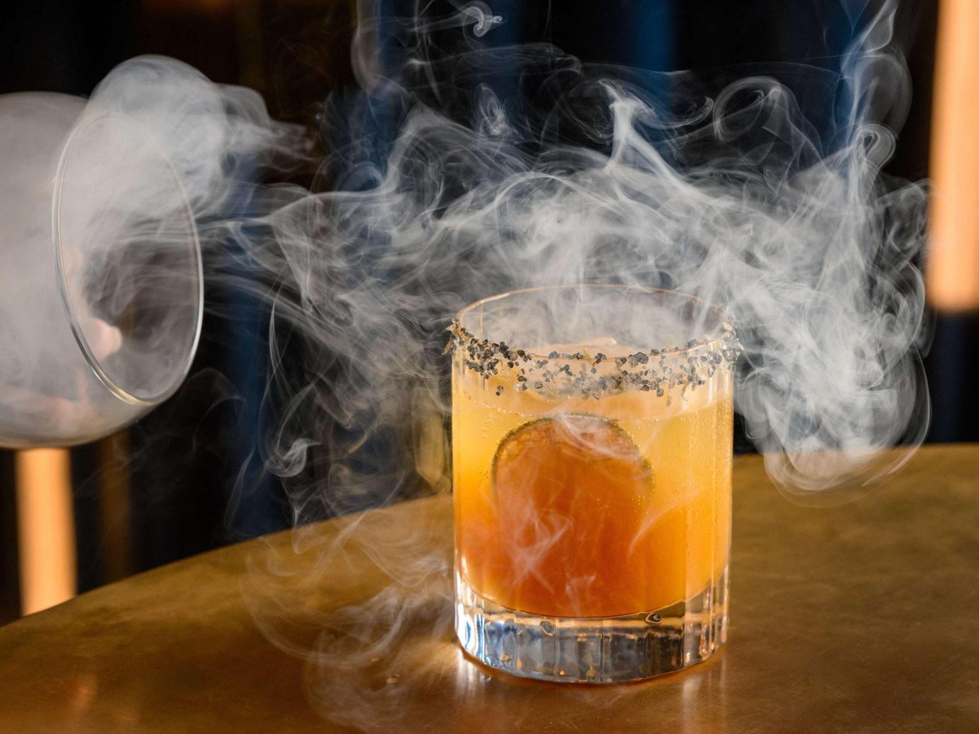 Pullman Budapest Exterior photo A smoked Old Fashioned
